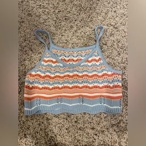 Super super cute top! Can be worn out and about or over a swimsuit